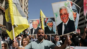 Palestinians celebrate with portraits of Palestinian leaders Yasser Arafat and Mahmoud Abbas during a rally in West Bank city of Nablus, on Sept. 23, 2025. Rallies were held in several cities across the West Bank on Tuesday to celebrate the Western recognition of the State of Palestine and to show solidarity with the people of the Gaza Strip. (Photo: Xinhua) 