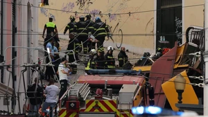 Firefighters and Public Security Police work on the site of the funicular accident in Lisbon, Portugal, on Sept. 3, 2025. The Gloria Funicular, one of Lisbon's best-known tourist attractions, derailed and overturned on Wednesday evening, leaving 15 people dead and 18 others injured, including five in serious condition, local media reported, citing police sources. (Photo: Xinhua)