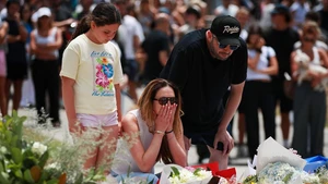 People mourn the victims of the Bondi Beach shooting in Sydney, Australia, Dec. 15, 2025. The death toll from a shooting at Sydney's Bondi Beach on Sunday has risen to 16, with a father and son identified as the attackers, police said Monday. (Photo: Xinhua)