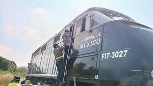 This photo taken with a mobile phone on Dec. 28, 2025 shows the site of a train derailment accident in Municipality of Asuncion Ixtaltepec, State of Oaxaca, Mexico. A passenger train carrying 241 passengers and nine crew members derailed on a bridge near Nizanda in southern Mexico on Sunday, leaving at least 13 people dead and 98 others injured, the Secretariat of the Navy said on social media. (Str/Xinhua)