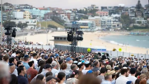 People gather at Bondi Beach for a memorial service to honor the victims of the deadly terror attack a week earlier in Sydney, Australia, Dec. 21, 2025, the National Day of Reflection. Thousands of people gathered at Sydney's Bondi Beach on Sunday evening to mark one week since a fatal mass shooting claimed the lives of 15 innocent people there. (Photo: Xinhua)