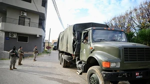 Soldiers from the Lebanese army guard trucks carrying weapons received from the Ain al-Hilweh Palestinian refugee camp in Sidon, Lebanon, Dec. 30, 2025. The Lebanese army on Tuesday received the fifth batch of weapons handed over from Palestinian refugee camps in Lebanon, as part of a state-led plan to centralize arms under national authority. (Photo: Xinhua)