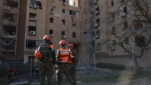 People work at the site of a missile strike in Be'er Sheva, Israel, on March 2, 2026. A missile from Iran struck a residential area in the southern Israeli city of Be'er Sheva on Monday, injuring at least 15 people, according to Israeli authorities. (Photo: Xinhua)