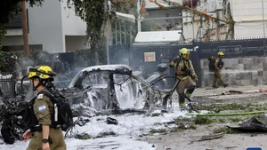 Israeli security and rescue forces work at the site of an Iranian strike in Tel Aviv, Israel, March 15, 2026. The U.S.-Israel-Iran conflict entered its 16th day on Sunday. (Photo: Xinhua)