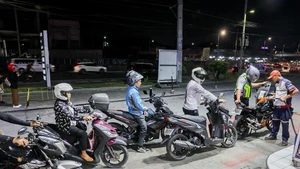 Motorcyclists line up to refuel their vehicles at a gas station in Quezon City, the Philippines, on March 9, 2026. Motorists across the Philippines swarmed gasoline stations on Monday, rushing to refuel ahead of a massive price hike scheduled for Tuesday. Oil prices are expected to increase by about 17 pesos to 24 pesos (roughly 0.29 USD to 0.40 dollars) per liter this week, said Energy Secretary Sharon Garin on Monday. (Photo: Xinhua)