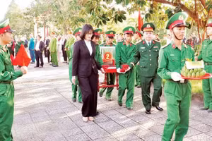 A memorial and burial ceremony for fallen soldiers’ remains at Cam Lo Commune Cemetery, Quang Tri Province.
