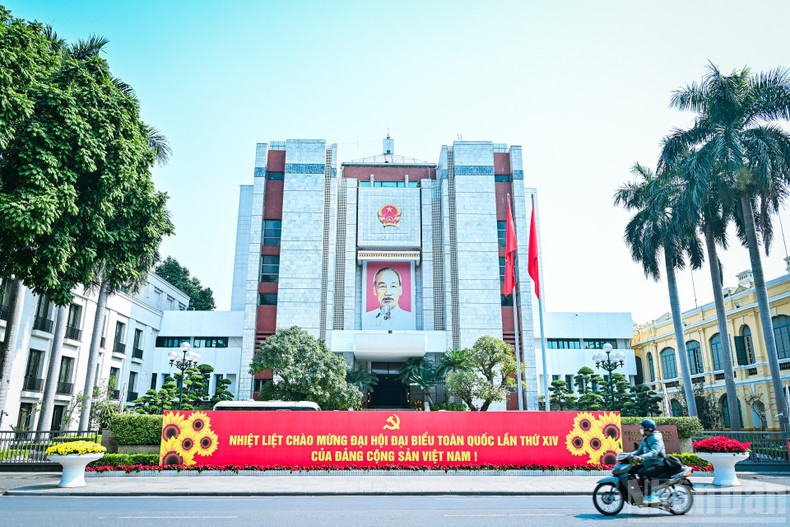 Large panels and slogans in front of the Ha Noi People’s Committee headquarters.