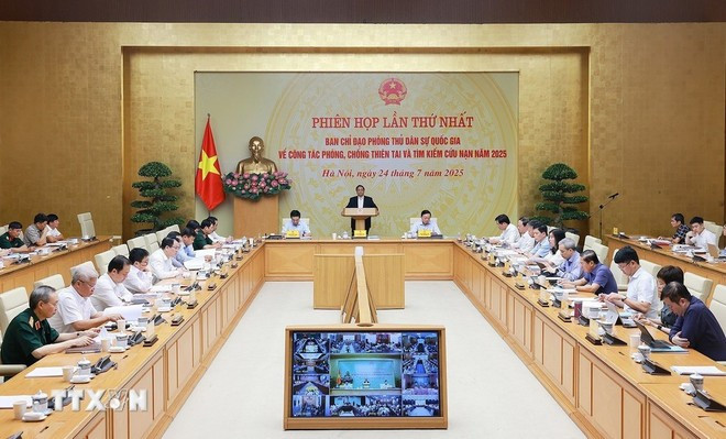 Prime Minister Pham Minh Chinh on July 24 chairs the first meeting of the National Civil Steering Committee on natural disaster prevention, control and search and rescue in 2025. (Photo: VNA)