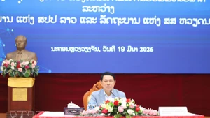 Lao Deputy Prime Minister and Chairman of the Laos–Viet Nam Cooperation Committee Saleumxay Kommasith speaks at the conference. (Photo: VNA)