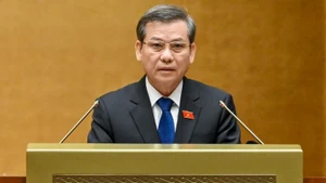 Chief Justice Le Minh Tri reports on the performance of the Supreme People's Court during 2021–2026 on October 20, 2025. (Photo: Duy Linh)