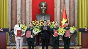 State President Luong Cuong (centre) and the newly promoted officers at the ceremony.