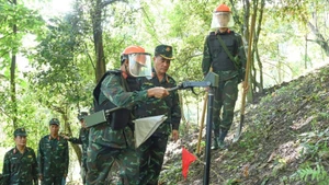 The Lung Lo Construction Corporation conducting mine and bomb clearance along the Viet Nam-China border.