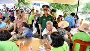 Residents of Can Gio Commune receive free medical check-ups.