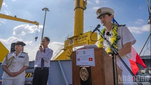 Lieutenant Colonel Wallerand Faivre D'Arcier speaks at the welcome ceremony.