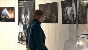 A visitor at the photo exhibition on the Phong Nha-Ke Bang caves.