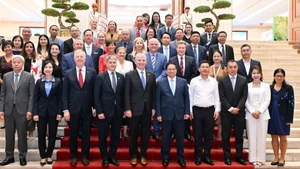 PM Pham Minh Chinh and the USABC delegation. (Photo: Tran Hai) 