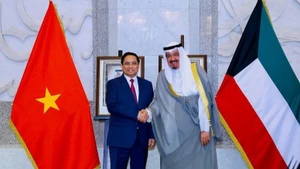 Prime Minister Pham Minh Chinh and Kuwaiti Prime Minister Sheikh Ahmad Abdullah Al-Ahmad Al-Sabah. (Photo: VGP)