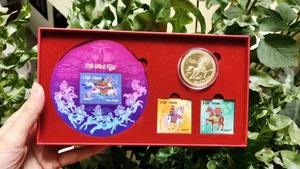 The horse-themed stamp set and commemorative coin.