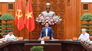 Prime Minister Pham Minh Chinh speaks at the meeting of the Government’s standing members on addressing the aftermath of natural disasters. (Photo: Tran Hai)