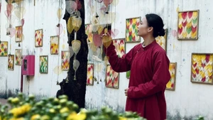 A nostalgic atmosphere in the bodhi leaf art courtyard at 22 Hang Buom Street, Ha Noi.
