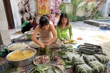 Square Chung cakes are wrapped in banana leaves.