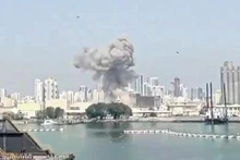 Plumes of smoke could be seen rising from the Naval Support Activity in Bahrain on February 28. About 100 Vietnamese workers are employed in the Middle East nation (Photo: AFP)