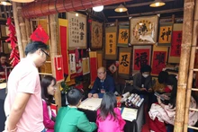 Visitors attend the Spring Calligraphy Festival 2026 at the Temple of Literature–Quoc Tu Giam.