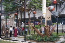 Aircraft wreckage and bomb casings are arranged to create an art space.