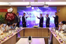 Delegates pressed the button to launch the Viet Nam Science and Technology Exchange. (Photo: nhandan.vn)