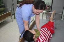 Caring for Agent Orange/dioxin victims. (Photo: VNA)