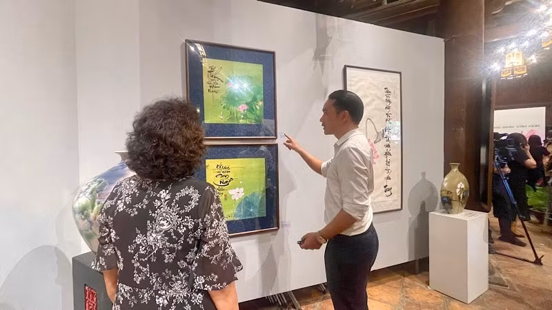 Visitors explore the 'Lotus and Kieu cultural space' exhibition