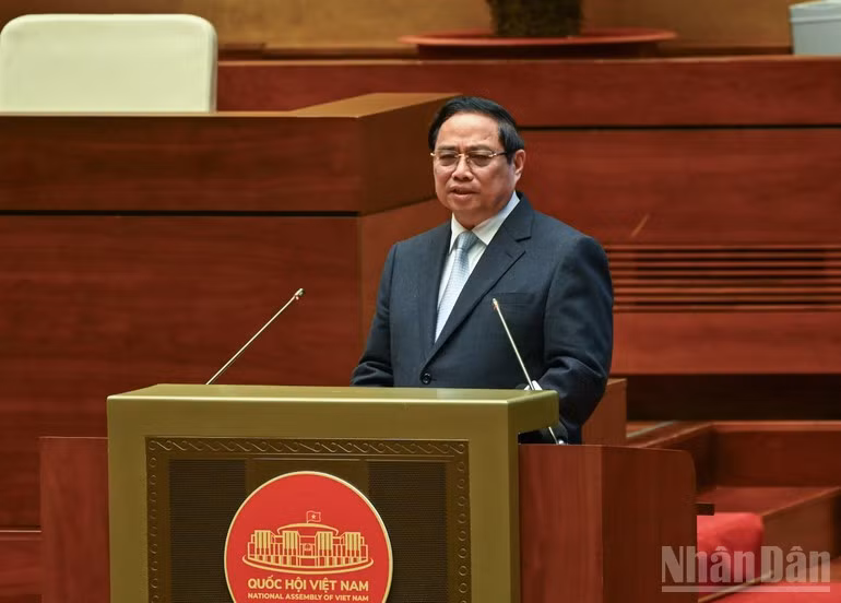 Prime Minister Pham Minh Chinh presents the action plan for implementing the Resolution of the 14th National Party Congress at the conference on February 7. (Photo: NDO)