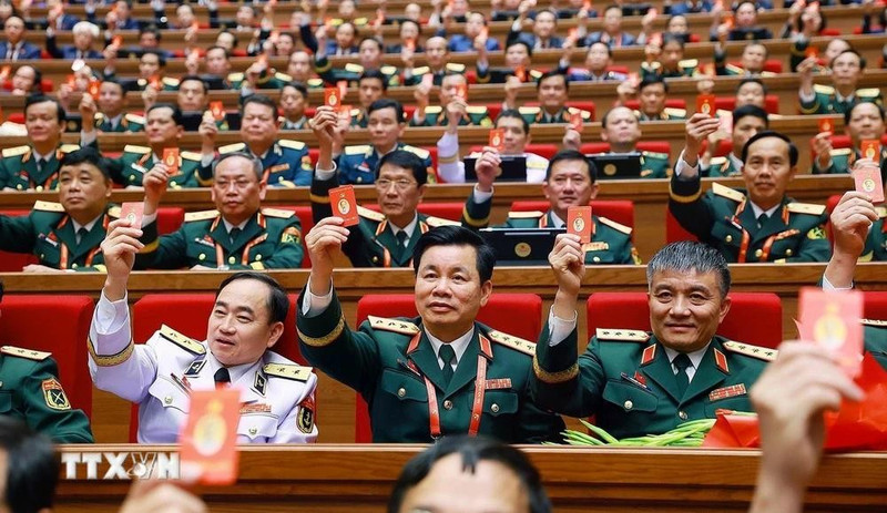 Delegates adopt the Resolution of the 14th National Party Congress (Photo: VNA)