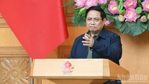 Prime Minister Pham Minh Chinh speaks at an emergency meeting on measures to address the aftermath of historic floods in central Viet Nam. (Photo: Tran Hai)