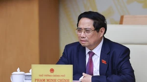 Prime Minister Pham Minh Chinh speaking at the meeting (Photo: VNA)