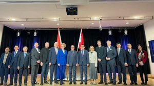 Delegates attend the forum.