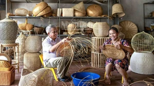 Artisans at work in a bamboo and rattan workshop in Phu Vinh Village, Phu Nghia Commune, Ha Noi.