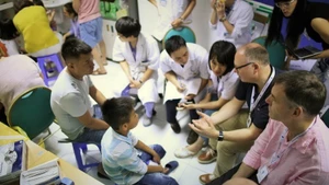 Doctors from the UK charity Facing The World (FTW) conduct screenings for pediatric patients at Viet Duc University Hospital during their 2018 mission. (Photo courtesy of FTW)