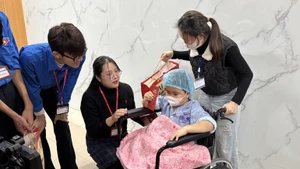 Gifts presented to a child patient ahead of Lunar New Year Festival (Tet)