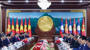 At the talks between General Secretary of the Communist Party of Viet Nam Central Committee To Lam and General Secretary of the Lao People’s Revolutionary Party Central Committee and President of Laos Thongloun Sisoulith. (Photo: VNA)