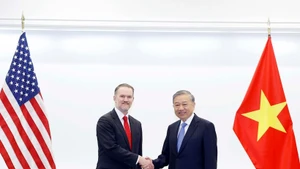 General Secretary of the Communist Party of Viet Nam To Lam (R) receives the US Trade Representative, Ambassador Jamieson Greer, in Washington D.C. on February 19. (Photo: VNA)
