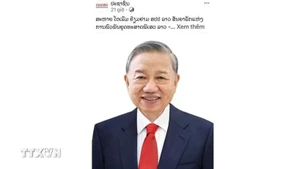 Pasaxon's article about General Secretary of the Communist Party of Viet Nam To Lam’s state visit to Laos. (Photo: VNA)