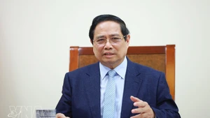 Prime Minister Pham Minh Chinh holds phone talks with the Prime Minister and Minister of Foreign Affairs of the State of Qatar, Sheikh Mohammed bin Abdulrahman bin Jassim Al-Thani. (Photo: VNA)