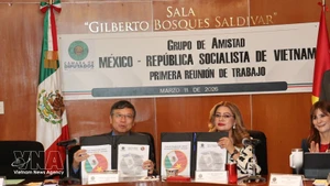 The signing ceremony of the Vietnam–Mexico parliamentary cooperation. agenda. (Photo: VNA)