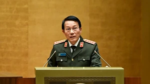 General Luong Tam Quang, Politburo member and Minister of Public Security, speaks at the national conference in Ha Noi on February 7. (Photo: NDO)