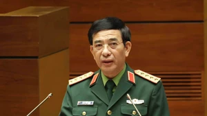 Politburo member, Deputy Secretary of the Central Military Commission and Minister of National Defence General Phan Van Giang speaks at the conference. (Photo: VNA)