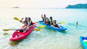 Tourists enjoying a kayaking trip on Thanh Lan Island