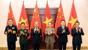 The Vietnamese and Chinese ministers of foreign affairs, national defence and public security pose for a photo at the first ministerial-level “3+3” strategic dialogue in Ha Noi on March 16. (Photo: VNA)