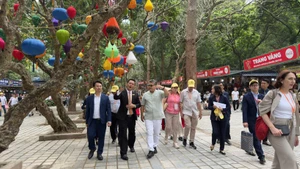 Delegation participating in the programme (Photo: VNA)