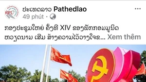 An article on the 14th National Congress of the Communist Party of Viet Nam published by the Lao News Agency (Photo: VNA)